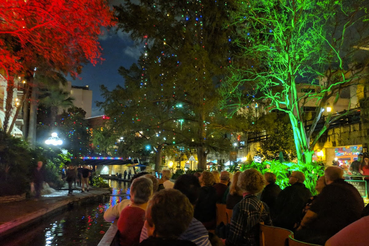 christmas lights in the trees and people cruising on the riverwalk - photo links to itinerary